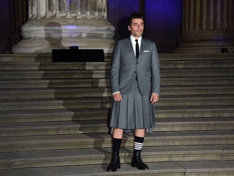 Oscar Isaac wearing a Thom Browne skirt suit at the Moon Knight premier